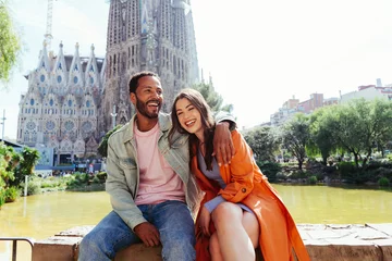 Foto auf Leinwand Multiracial beautiful happy couple of lovers dating in Barcelona © oneinchpunch
