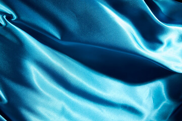 a gleaming cloth that flows like water