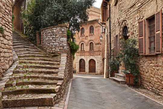Corciano, Perugia, Umbria, Italy: picturesque corner in the old town with  an ancient staircase and the 15th century building Palazzo del Capitano