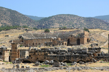 Fototapeta na wymiar Roman amphitheatre in the ruins of Hierapolis, in Pamukkale, Denizli City, Turkey.