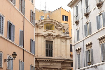 Fototapeta na wymiar Rome Street View with Santa Maria in Publicolis Church Facade, Italy