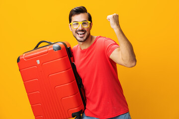 Man vacation yellow travel weekend trip traveler happy studio journey baggage suitcase flight...