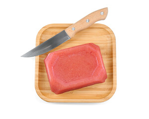 Delicious sweet quince paste and knife isolated on white, top view