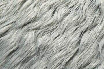 Texture of grey faux fur as background, closeup