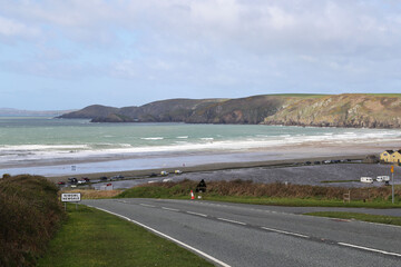 The road leading down the hill to the flooded coastal road in Newgale, Pembrokeshire, Wales, UK.