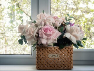 Still life with basket of delicate roses