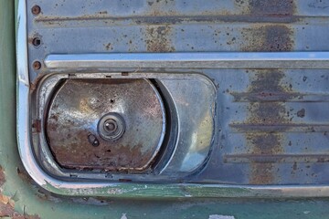 Fototapeta na wymiar Closeup of a broken headlight of an old abandoned bus.
