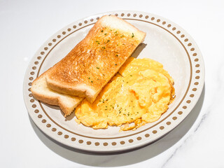 Hearty Breakfast Plate with Scrambled Eggs and Golden Toast