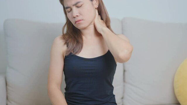 Woman having Shoulder and Neck pain at home. Muscle painful due to Myofascial pain syndrome and Fibromyalgia, rheumatism, Scapular pain, Cervical Spine. ergonomic concept