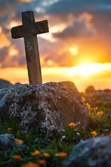 Symbolic representation of resurrection  empty tomb stone with cross on sunrise meadow field