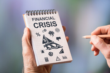 Financial crisis concept on a notepad
