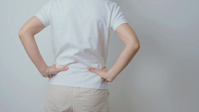 woman having back body ache during at home. adult female with muscle pain due to Piriformis Syndrome, Low Back Pain and Spinal Compression. Office syndrome and medical concept