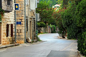 A narrow street in the resort village of Prcanj in Montenegro on the shores of the Bay of Kotor