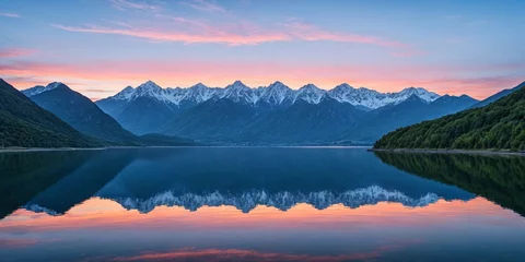 Door stickers Reflection Majestic peaks reflected in a calm lake at sunset. Dawn in the mountains. Panoramic view of the beautiful mountain landscape.