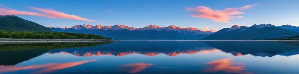 Washable wall murals Reflection Majestic peaks reflected in a calm lake at sunset. Dawn in the mountains. Panoramic view of the beautiful mountain landscape.