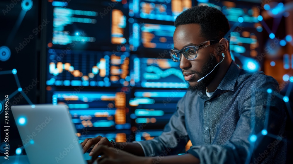 Poster an internet it specialist in a data center uses his laptop and pc to develop software to ensure the 