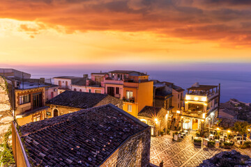 amazing evening view from mountain town to beautiful italian town with roofs and biuldings and...