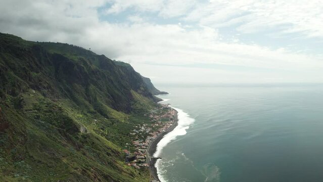 View of Stunning Coastline, Steep Mountain, Fishing Village, Cloudy Day