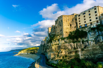 beautiful paniramic town of Tropea in Italy with scenic blue sea coast and old historic houses on a high rock mountain abobe coast, travel europe landscape