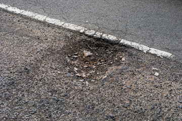 A pothole in a road in Weston-super-Mare, UK on 18 April 2024, part of a widespread problem...