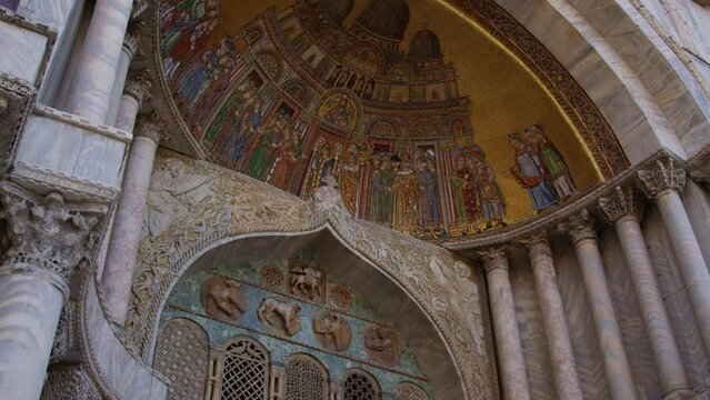 Detail of an ornate mosaic on the facade of St. Mark's Basilica, showcasing intricate artwork with religious motifs