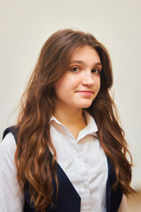 Fototapeta premium A high school student in uniform on a white background.
