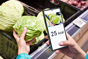 Checking calories on cabbage vegetable with smartphone