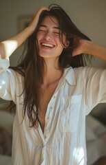Fototapeta premium Woman Smiling and Holding Hair