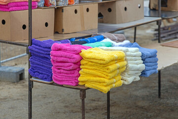 Stack of Colour Terry Towels at Market Stall