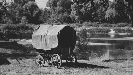 Close-up View On Russian Soviet World War Ii Peasant Cart On River Bank. Wwii Equipment Of Red Army. Historical Re-enactment. Black And White .