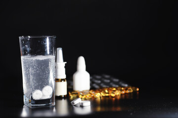 Composition from Bottles of cough syrup.Healthcare, medicine, flu and treatment concept - paper wipes and thermometer with pills.