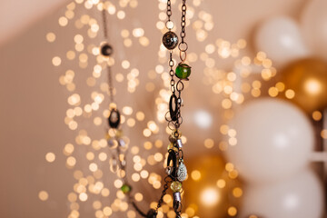 A close-up view of a detailed necklace, featuring ornate designs and beads, perfect for a stylish look.