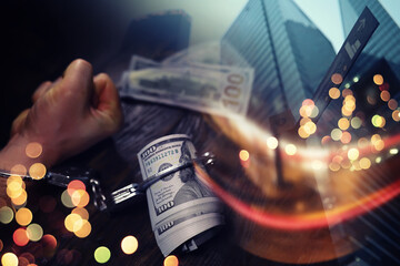  Double exposure city and hands of a man with handcuffs on a background of us dollars. Fraud, cyber crime concept. Arrest of an entrepreneur in the workplace. - obrazy, fototapety, plakaty
