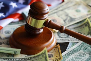judge gavel and money on brown wooden table concept - obrazy, fototapety, plakaty