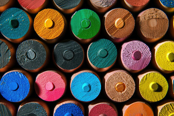 Vibrant array of assorted colored pencils in a row with one standing out in the center