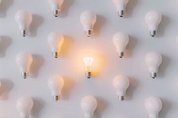 Many lightbulbs on a white background with lights on