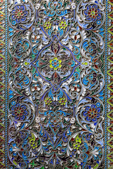 Detailed traditional Uzbek enamel ornament, silver, luxurious floral design with vibrant colors....
