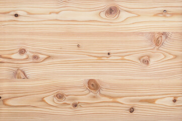Surface of a natural untreated rustic style larch veneer texture background wallpaper without...