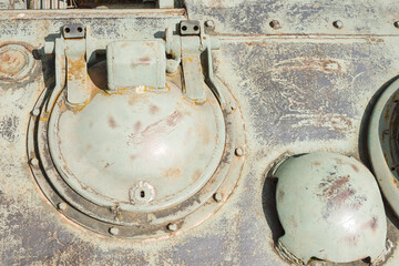 Details of the old Soviet tank. Military green camouflage metal background