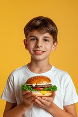 Child relishing a tasty hamburger on soft pastel background, ideal for adding text creatively.