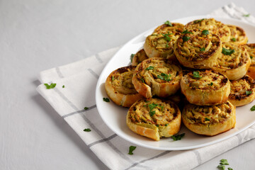 Homemade Chicken Pesto Pinwheels on a Plate, side view. Copy space. - 789225173
