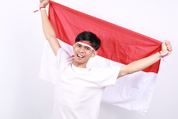 Asian men standing to celebrate Indonesia's independence smiled happily waving red and white flags...