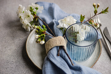 Elegant spring table setting with cherry blossoms