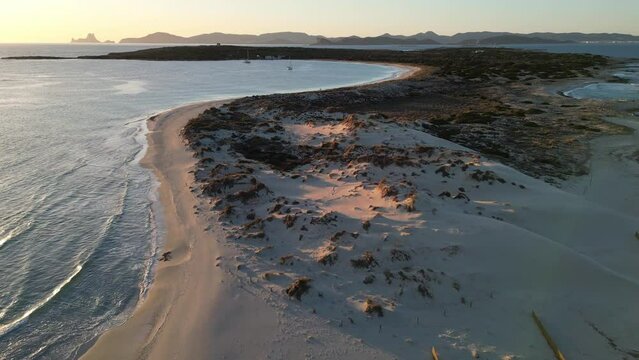 Espalmador beach, Formentera, at sunset. Ibiza and Es Vedra in the background.