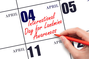 April 4. Hand writing text International Day for Landmine Awareness on calendar date. Save the date.