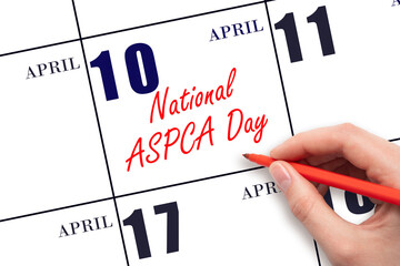 April 10. Hand writing text National ASPCA Day on calendar date. Save the date.