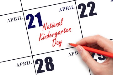 April 21. Hand writing text National Kindergarten Day on calendar date. Save the date.