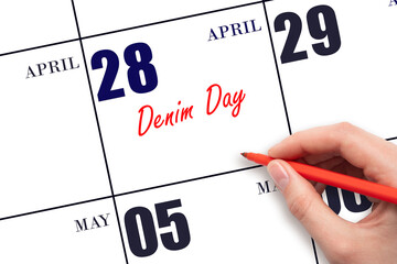 April 28. Hand writing text Denim Day on calendar date. Save the date.
