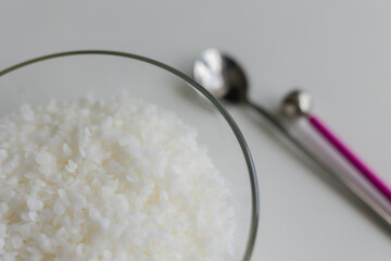 close-up of candle wax in granules on a light background
