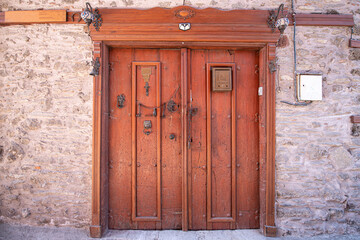 Traditional Ottoman Houses and historical inn doors in Manisa. Kula is on the UNESCO World Heritage List. Old wooden mansions Turkish architecture. Kula historical wooden and metal doors.